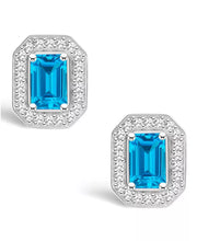 Blue Topaz (1-2/5 Ct. T.W.) and Diamond (1/5 Ct. T.W.) Halo Studs in Sterling Silver