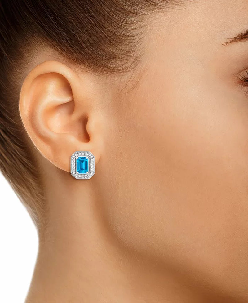 Blue Topaz (1-2/5 Ct. T.W.) and Diamond (1/5 Ct. T.W.) Halo Studs in Sterling Silver